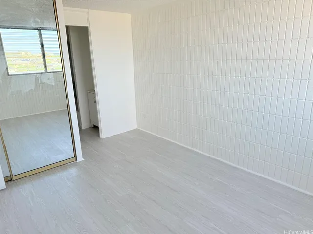 a white toilet sitting next to a bath tub