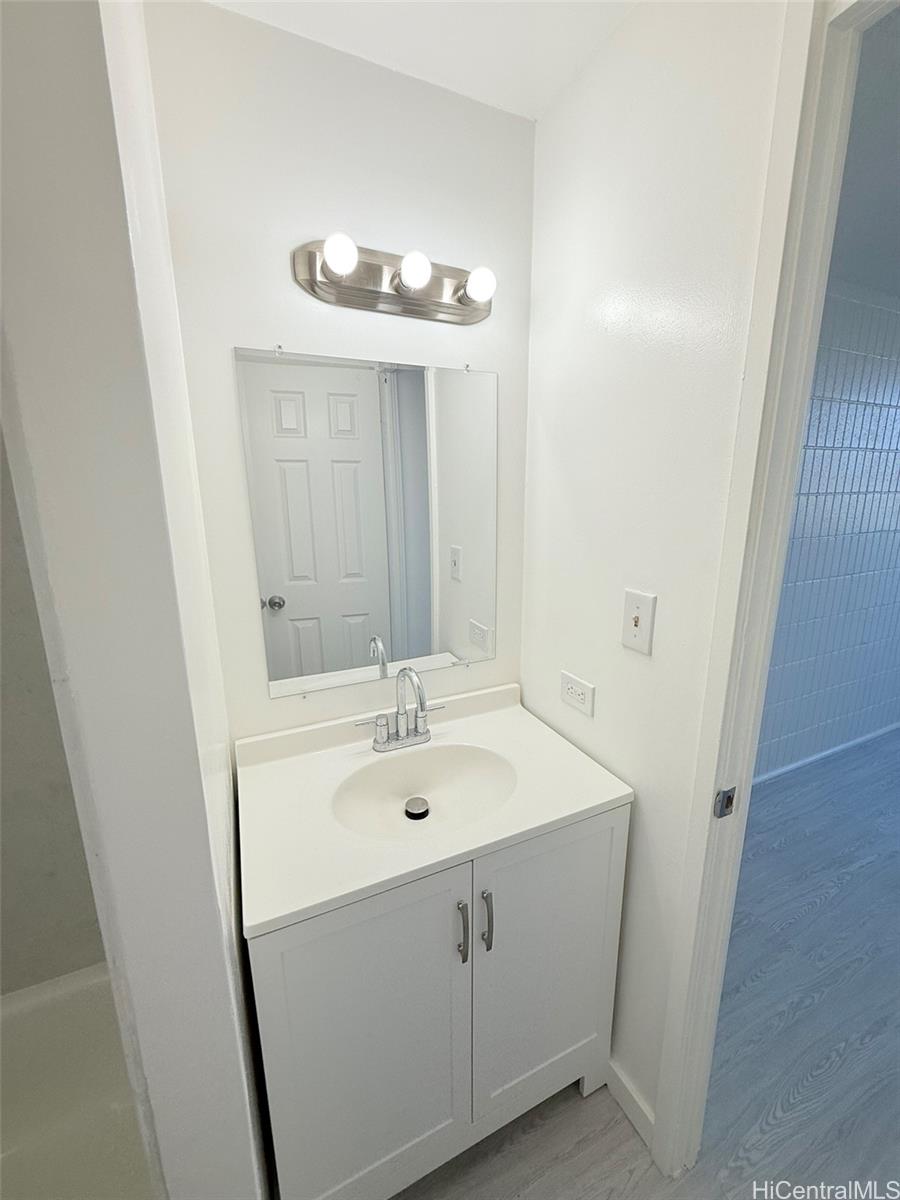 3215 Ala Ilima Street, Unit A1202 Honolulu, HI 96818 - Photo 10 of 20 a bathroom with a sink and a mirror
