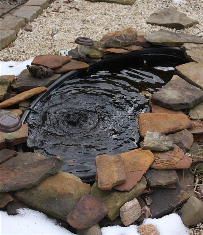 160 West County Line Road Jamestown, PA 16134 - Photo 6 of 18 Koi Pond landscaped into the side deck area