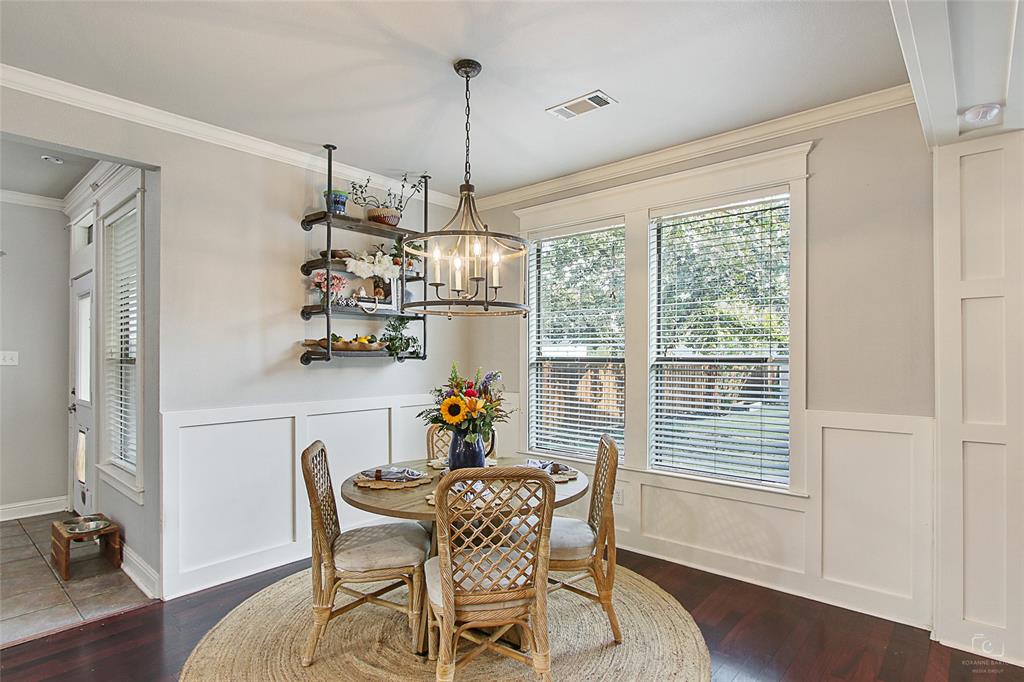 263 West Jefferson Street Van Alstyne, TX 75495 - Photo 11 of 32 a dining room with furniture a chandelier and wooden floor