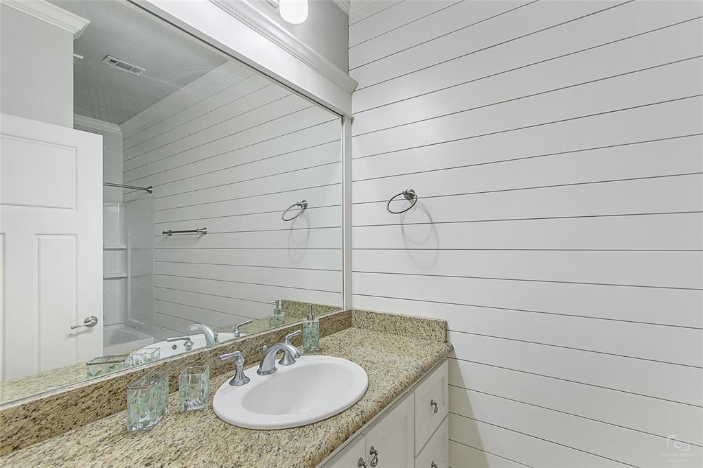 263 West Jefferson Street Van Alstyne, TX 75495 - Photo 18 of 32 a bathroom with a sink and a mirror