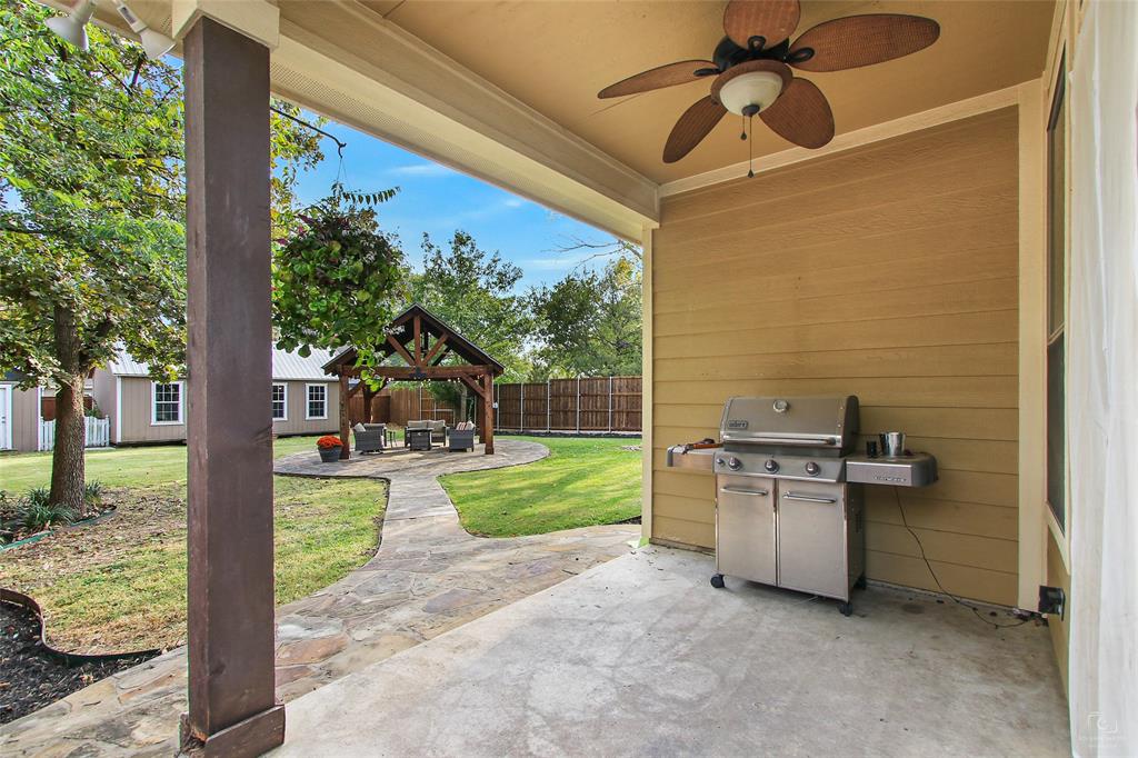 263 West Jefferson Street Van Alstyne, TX 75495 - Photo 25 of 32 a view of a porch with furniture and a yard