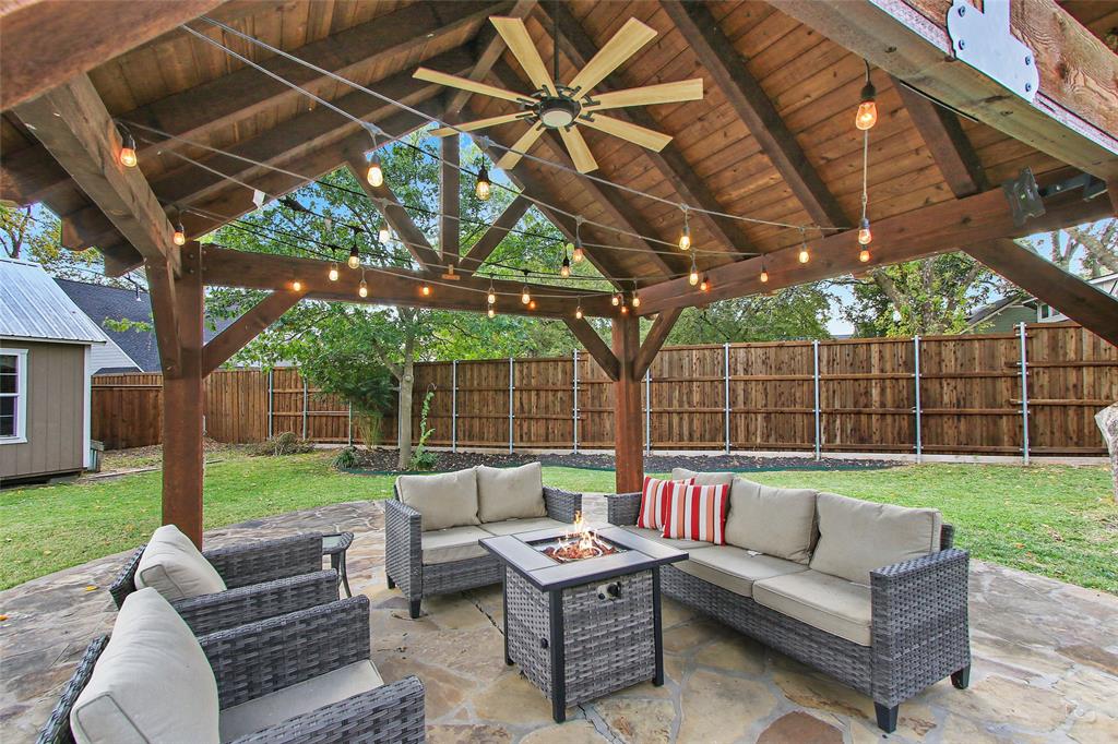 263 West Jefferson Street Van Alstyne, TX 75495 - Photo 29 of 32 a view of a backyard with couches table and chairs