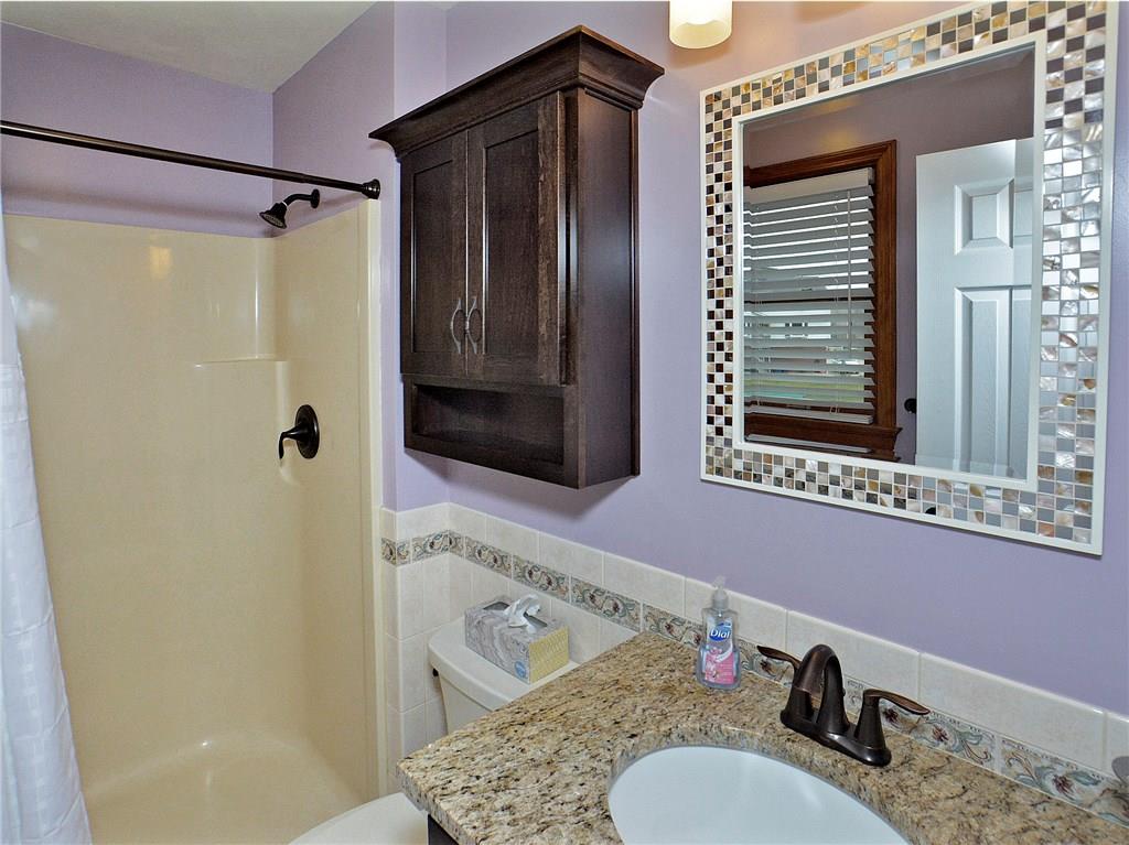 77 Rustic Ridge Drive Pittsburgh, PA 15239 - Photo 14 of 25 Updated master bath remodeled in 2018 w/ custom Manor House cabinets w/ granite countertop.