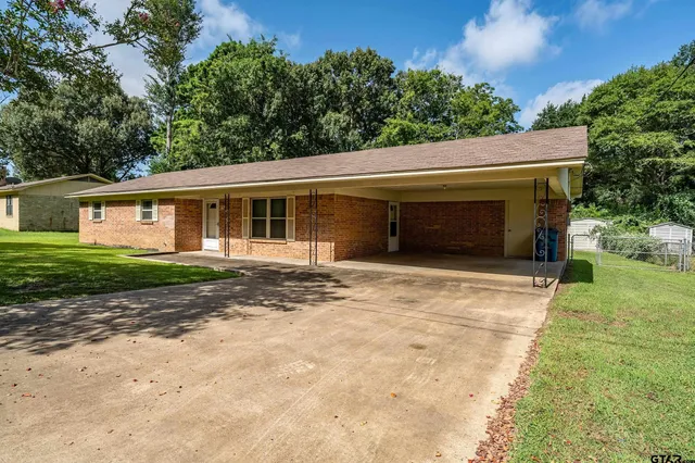 a house with trees in the background