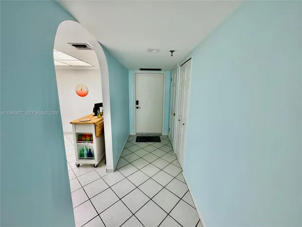 a view of a hallway with bathroom