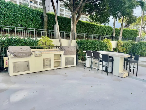 a view of a swimming pool with outdoor seating space