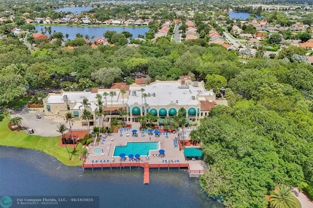 an aerial view of multiple houses with outdoor space