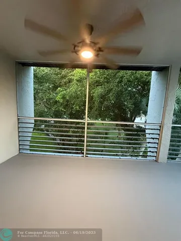 a view of a room with a large window