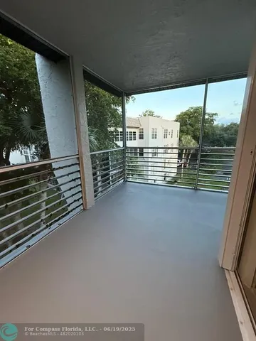 a view of a balcony with chairs