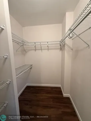 a view of an empty walk in closet