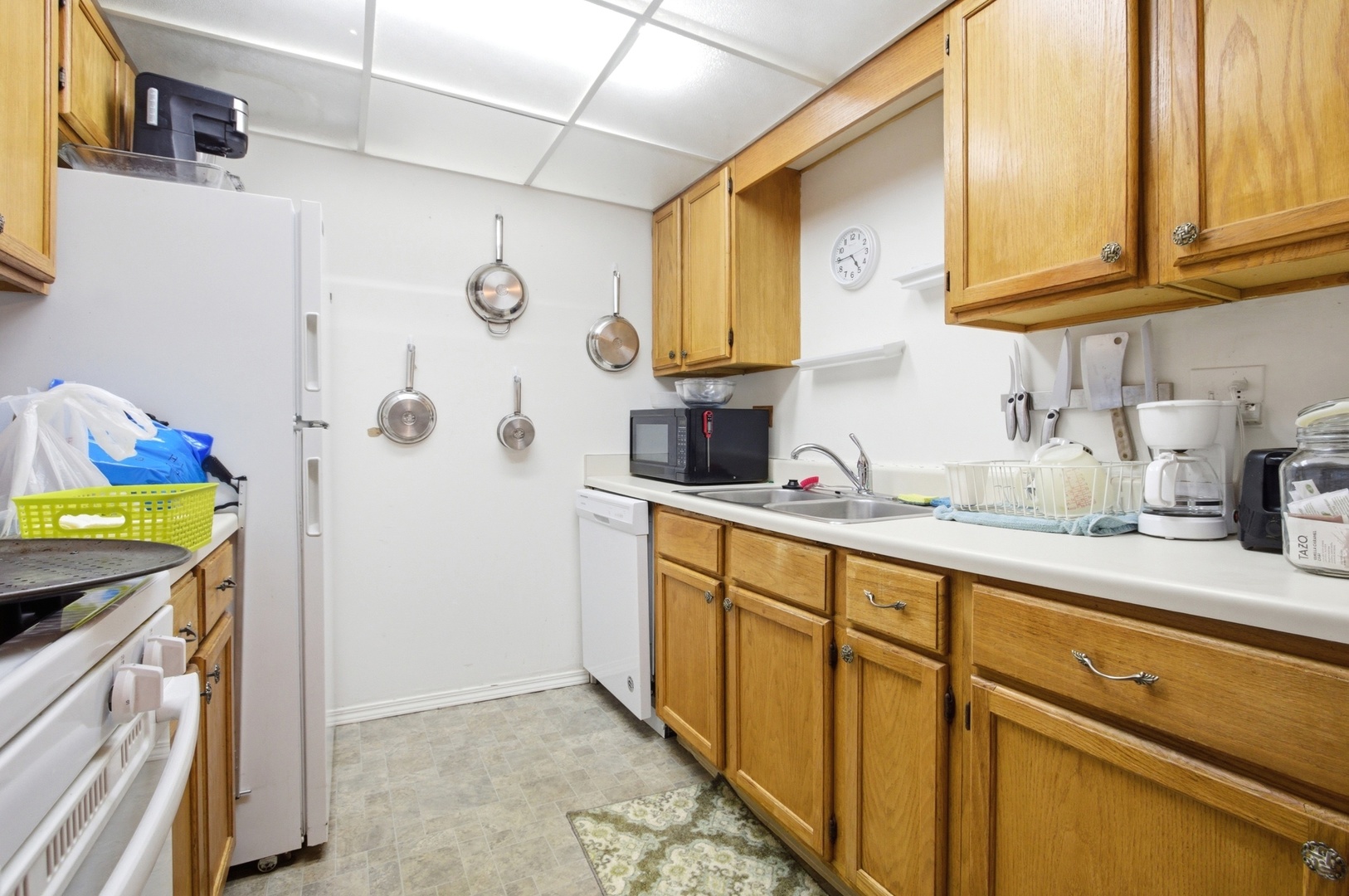 154 East Bailey Road, Unit D Naperville, IL 60565 - Photo 6 of 20 a kitchen with stainless steel appliances granite countertop a sink a stove a refrigerator and cabinets