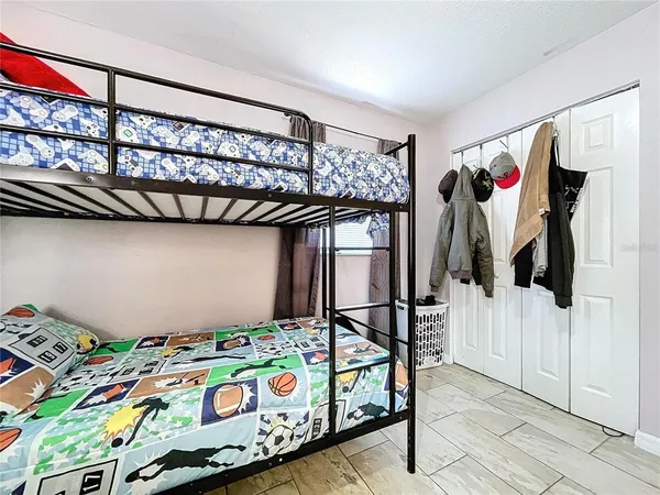 a bedroom with furniture and a window