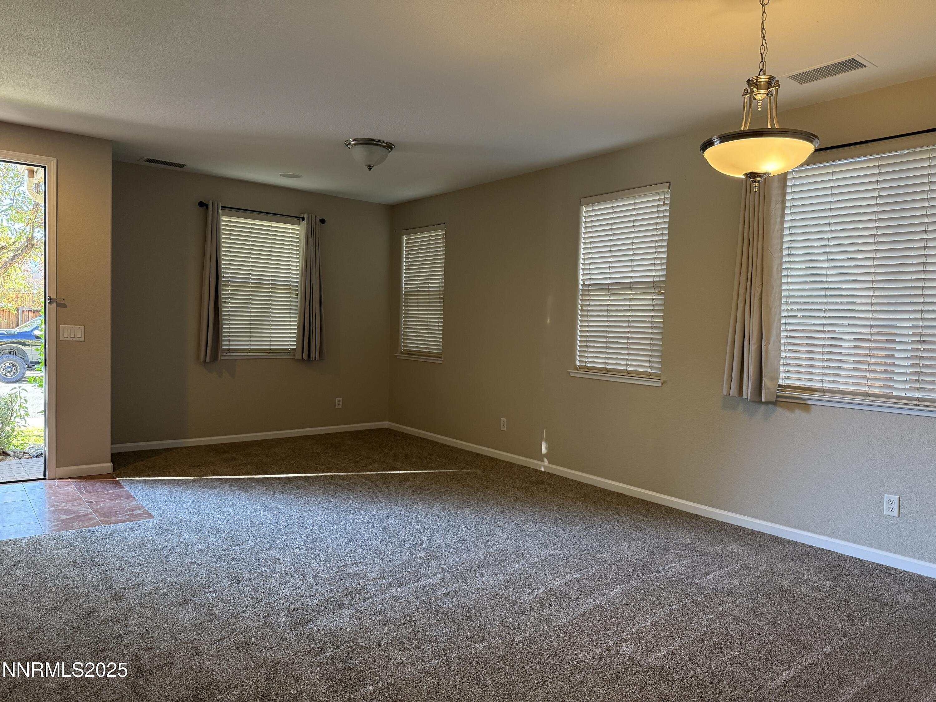 435 Stradella Court Reno, NV 89521 - Photo 12 of 33 an empty room with windows