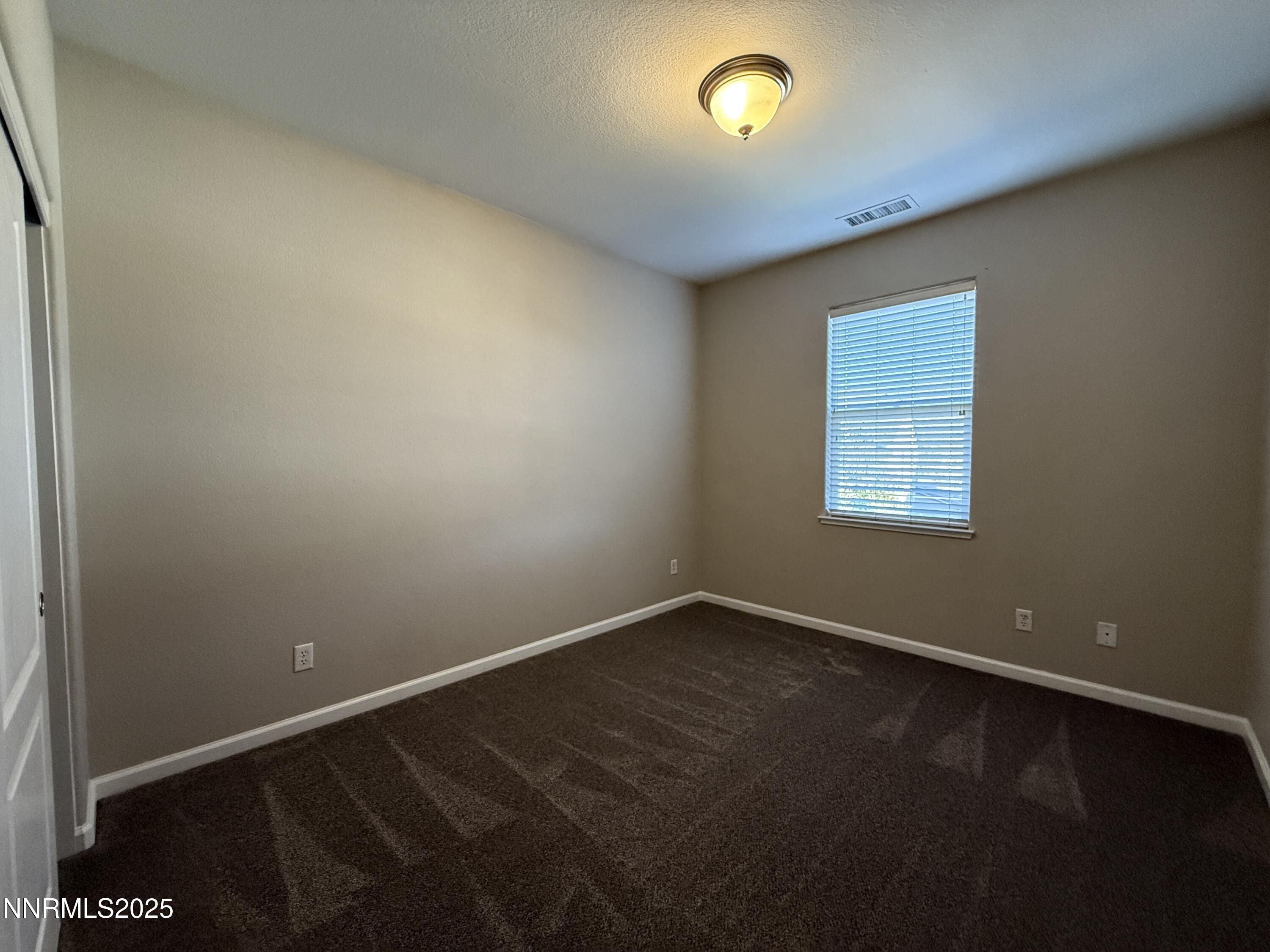 435 Stradella Court Reno, NV 89521 - Photo 19 of 33 an empty room with a window
