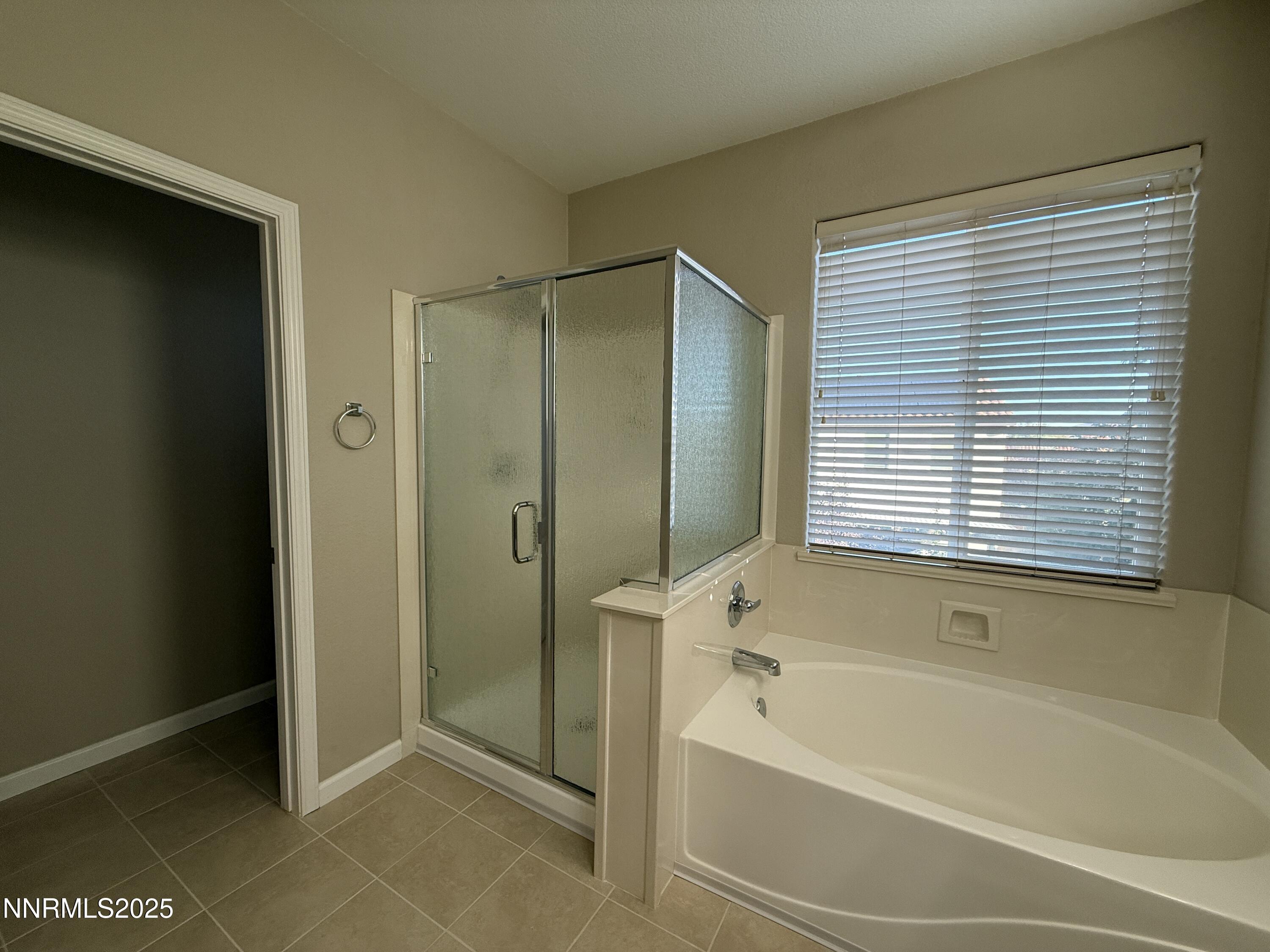 435 Stradella Court Reno, NV 89521 - Photo 24 of 33 a bathroom with a bathtub and a shower