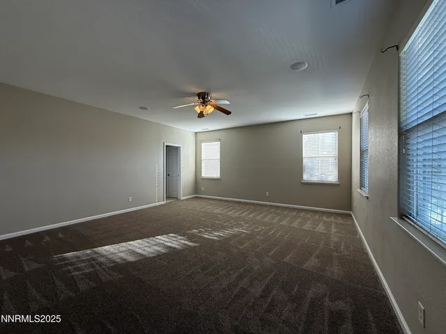 a view of empty room with fan