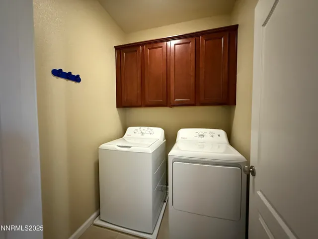 a bathroom with a double vanity sink toilet and a bathtub