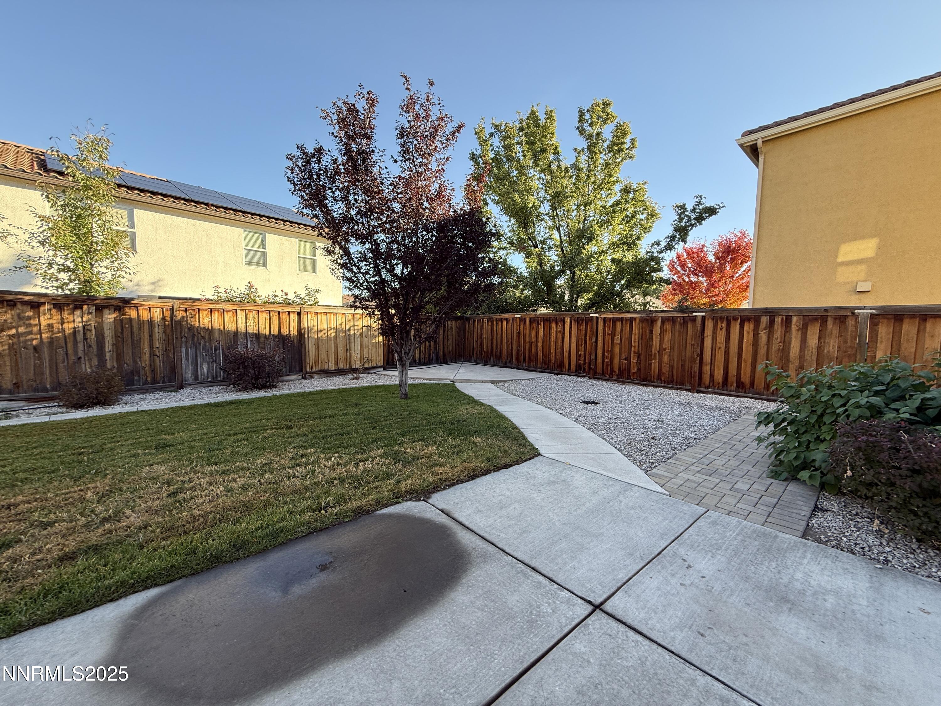 435 Stradella Court Reno, NV 89521 - Photo 6 of 33 a view of a backyard with a garden