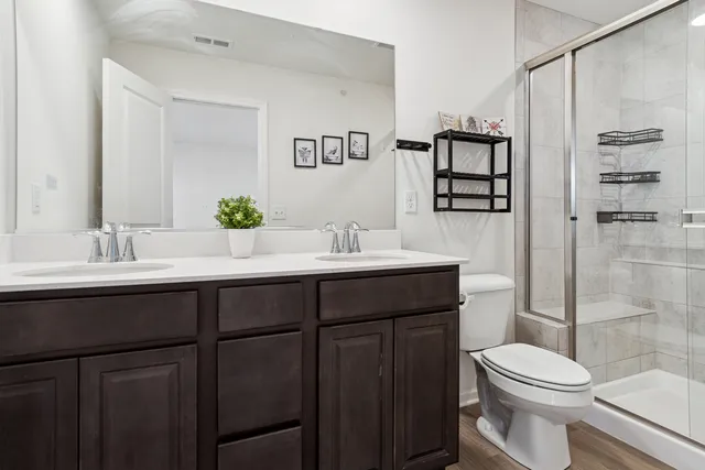 a bathroom with a sink toilet and shower