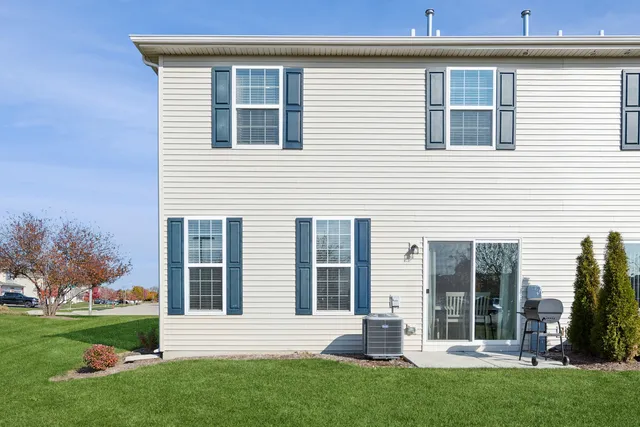 a view of a house with a yard and plants