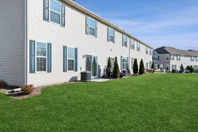a view of house with yard