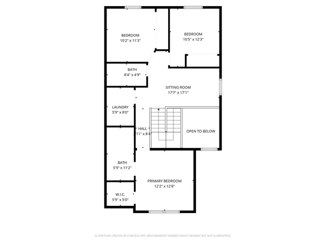 a picture of a bench in front of a building