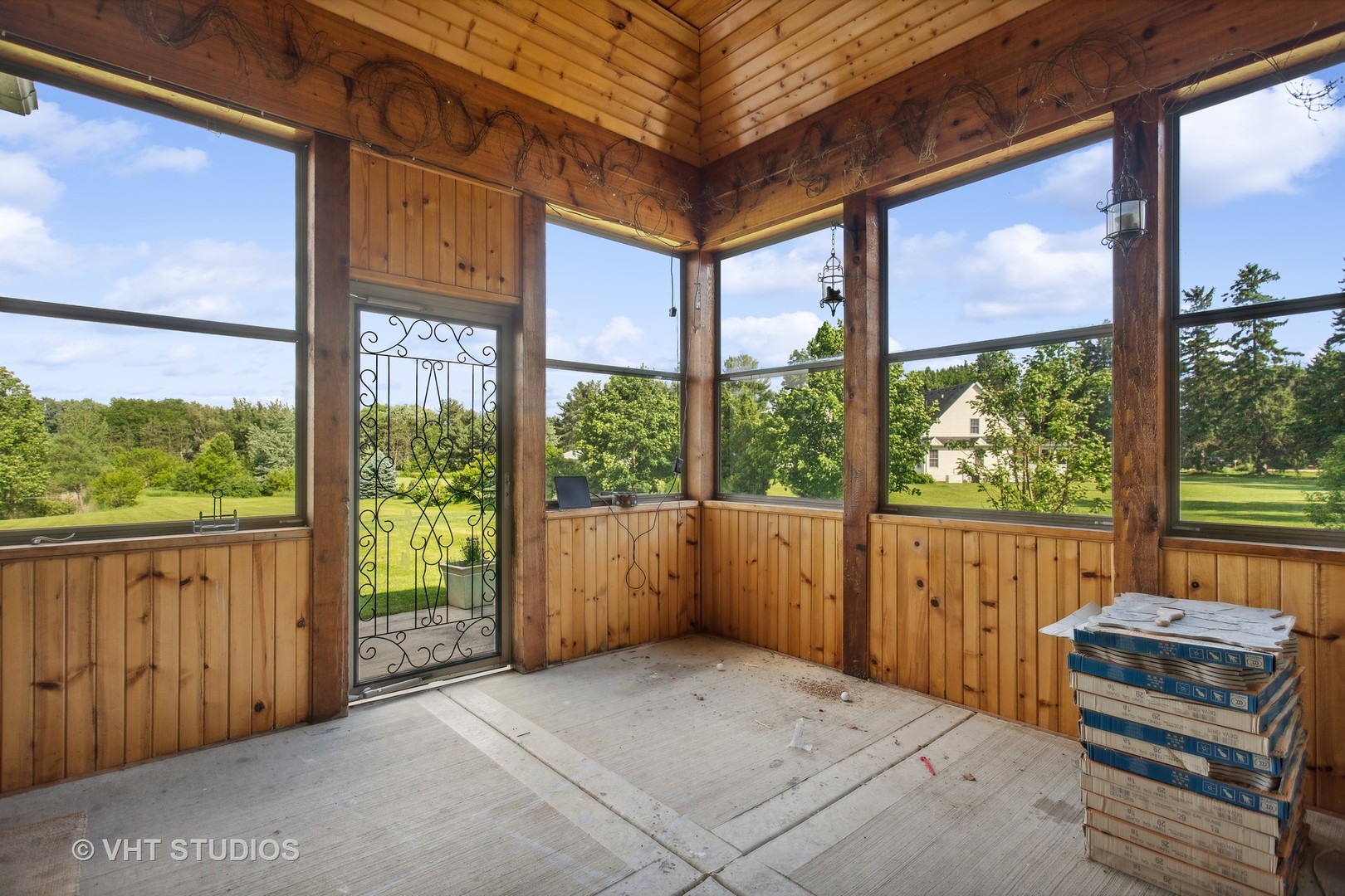 41W640 Burlington Road St. Charles, IL 60175 - Photo 12 of 39 a view of a porch with wooden floor and outdoor space