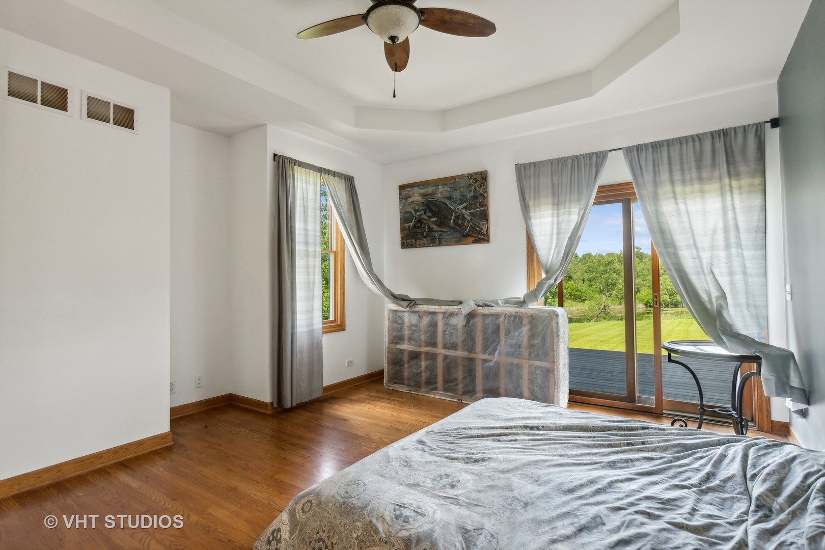 41W640 Burlington Road St. Charles, IL 60175 - Photo 14 of 39 a bedroom with a bed a chandelier and large window