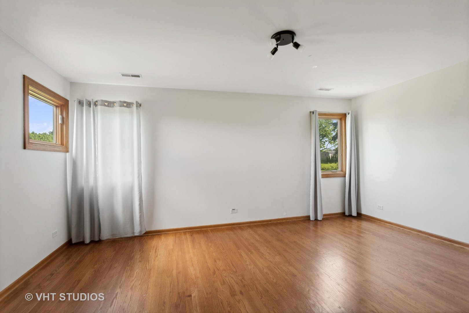 41W640 Burlington Road St. Charles, IL 60175 - Photo 19 of 39 an empty room with wooden floor and windows
