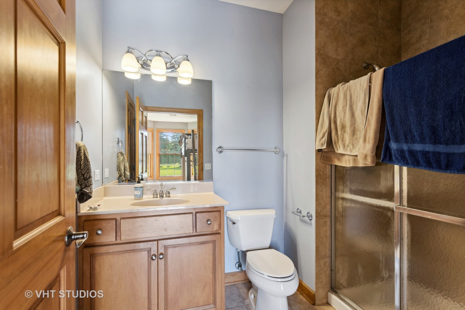 41W640 Burlington Road St. Charles, IL 60175 - Photo 20 of 39 a bathroom with a sink vanity mirror and toilet
