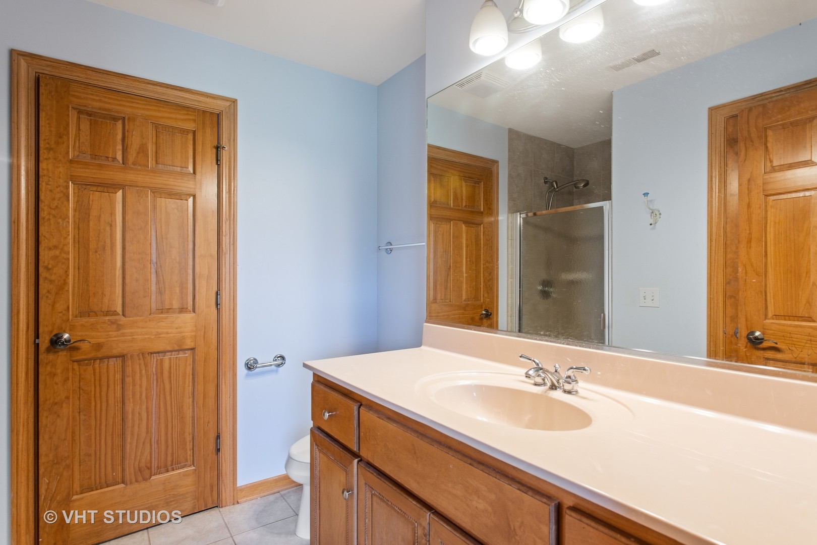 41W640 Burlington Road St. Charles, IL 60175 - Photo 22 of 39 a bathroom with a sink and a mirror