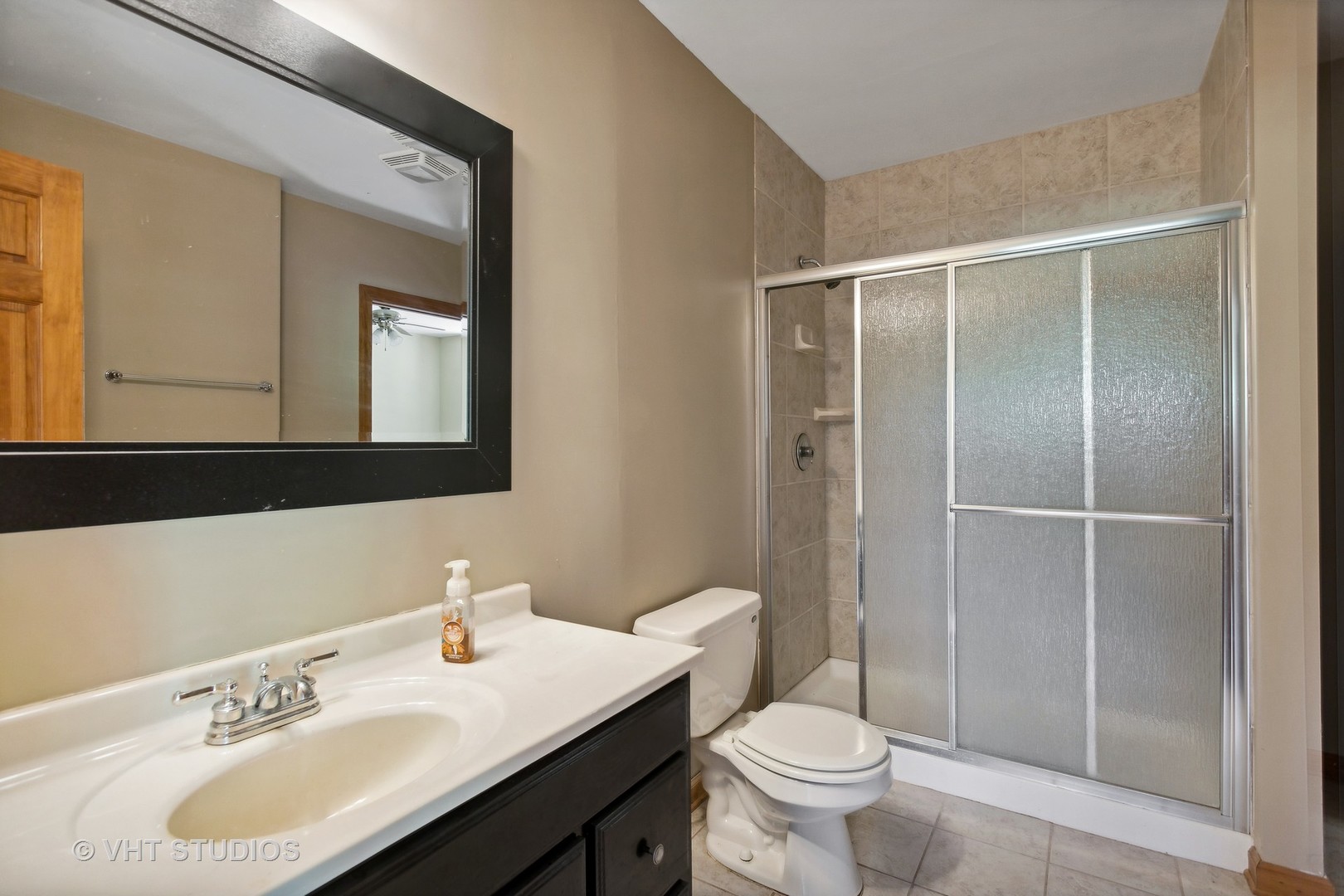 41W640 Burlington Road St. Charles, IL 60175 - Photo 24 of 39 a bathroom with a sink toilet and shower