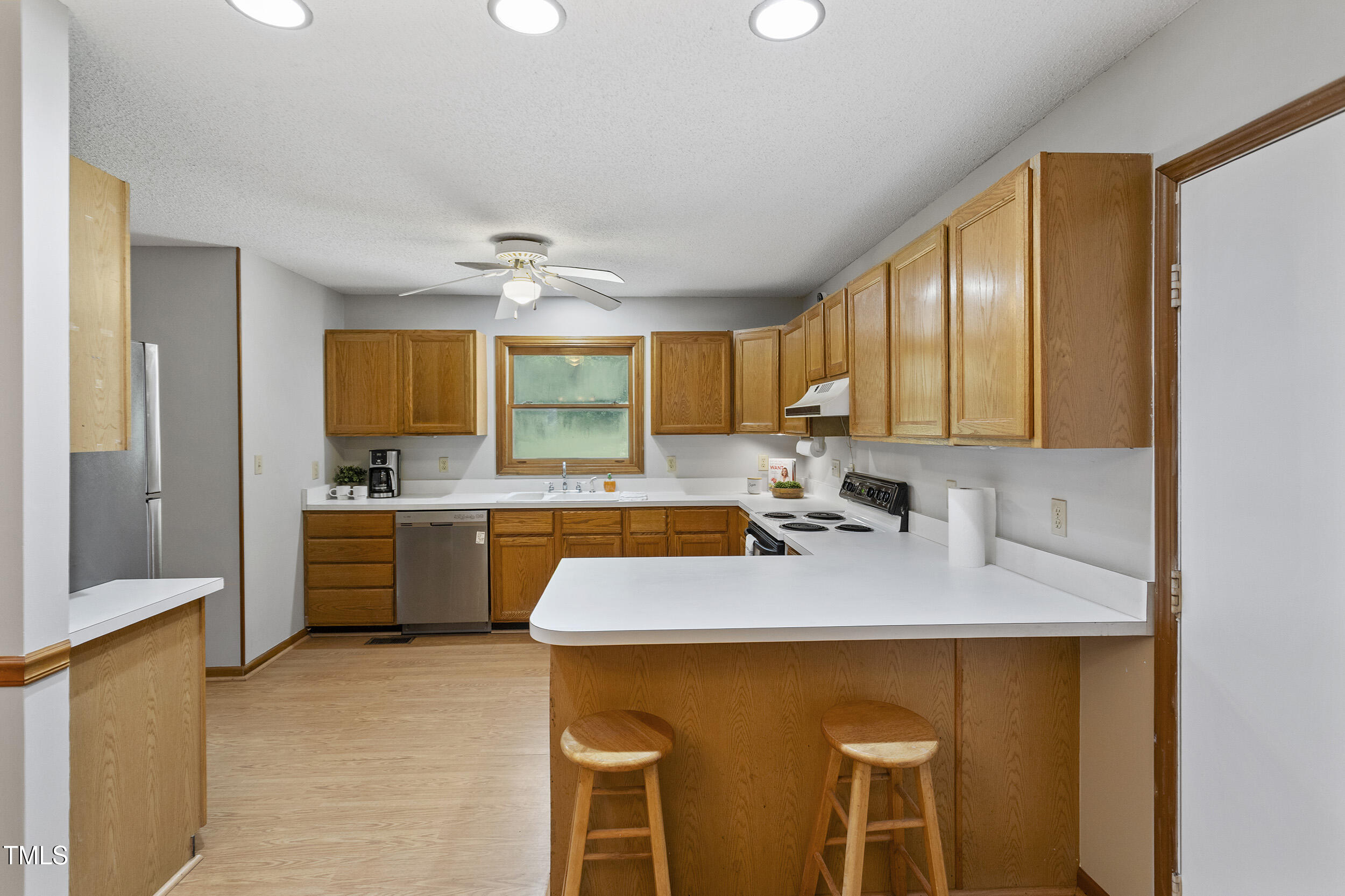 9505 Neils Branch Road Raleigh, NC 27603 - Photo 20 of 41 a kitchen with a sink cabinets and counter space