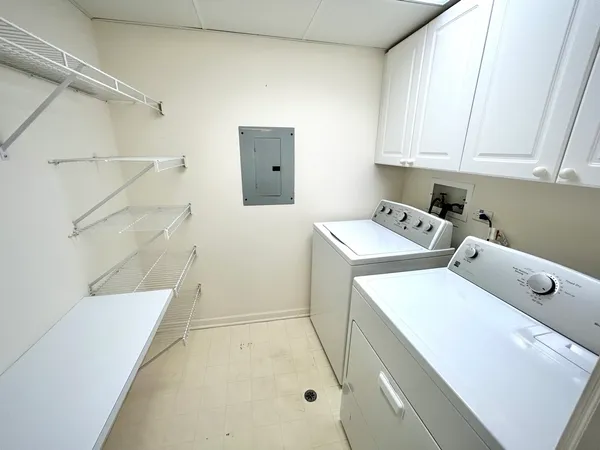 a bathroom with a sink a toilet and shower curtain