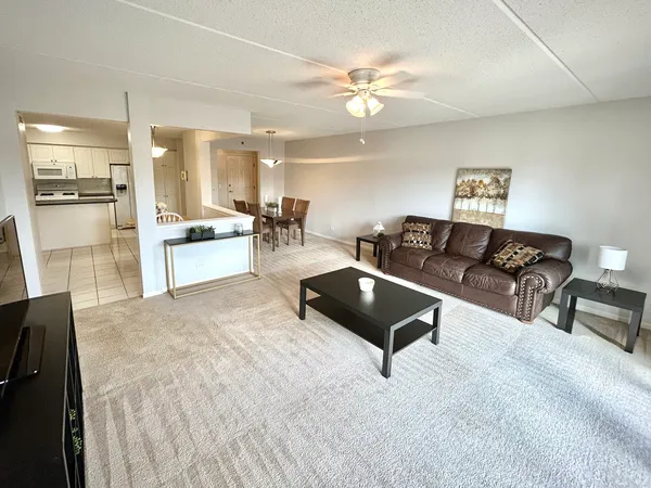 a living room with furniture and a table