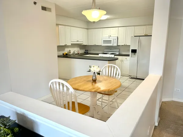 a kitchen with a sink and a refrigerator