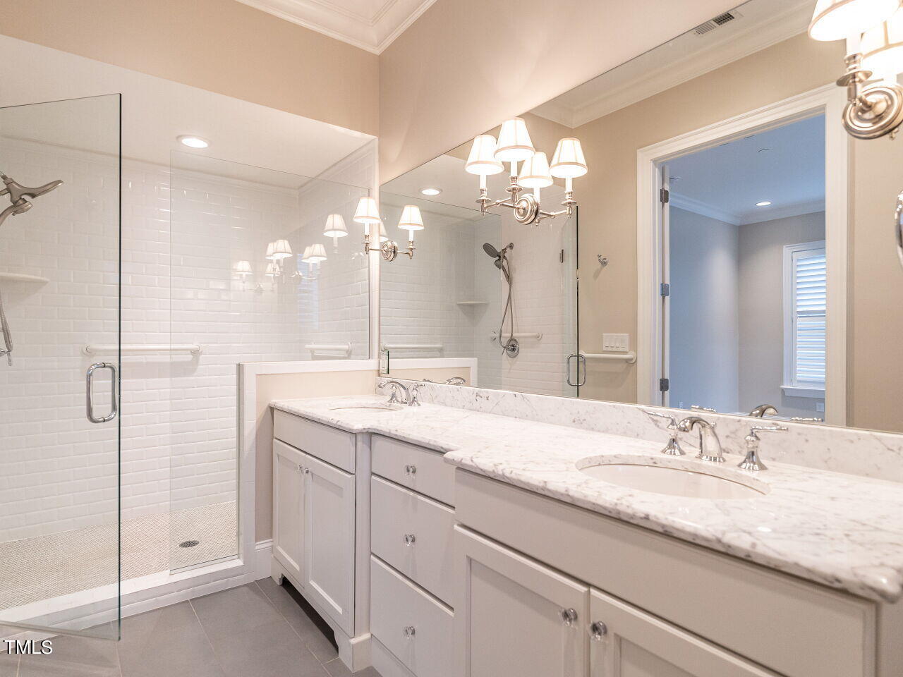 2017 Fairview Road, Unit 100 Raleigh, NC 27608 - Photo 25 of 32 a bathroom with a granite countertop sink two mirror and shower