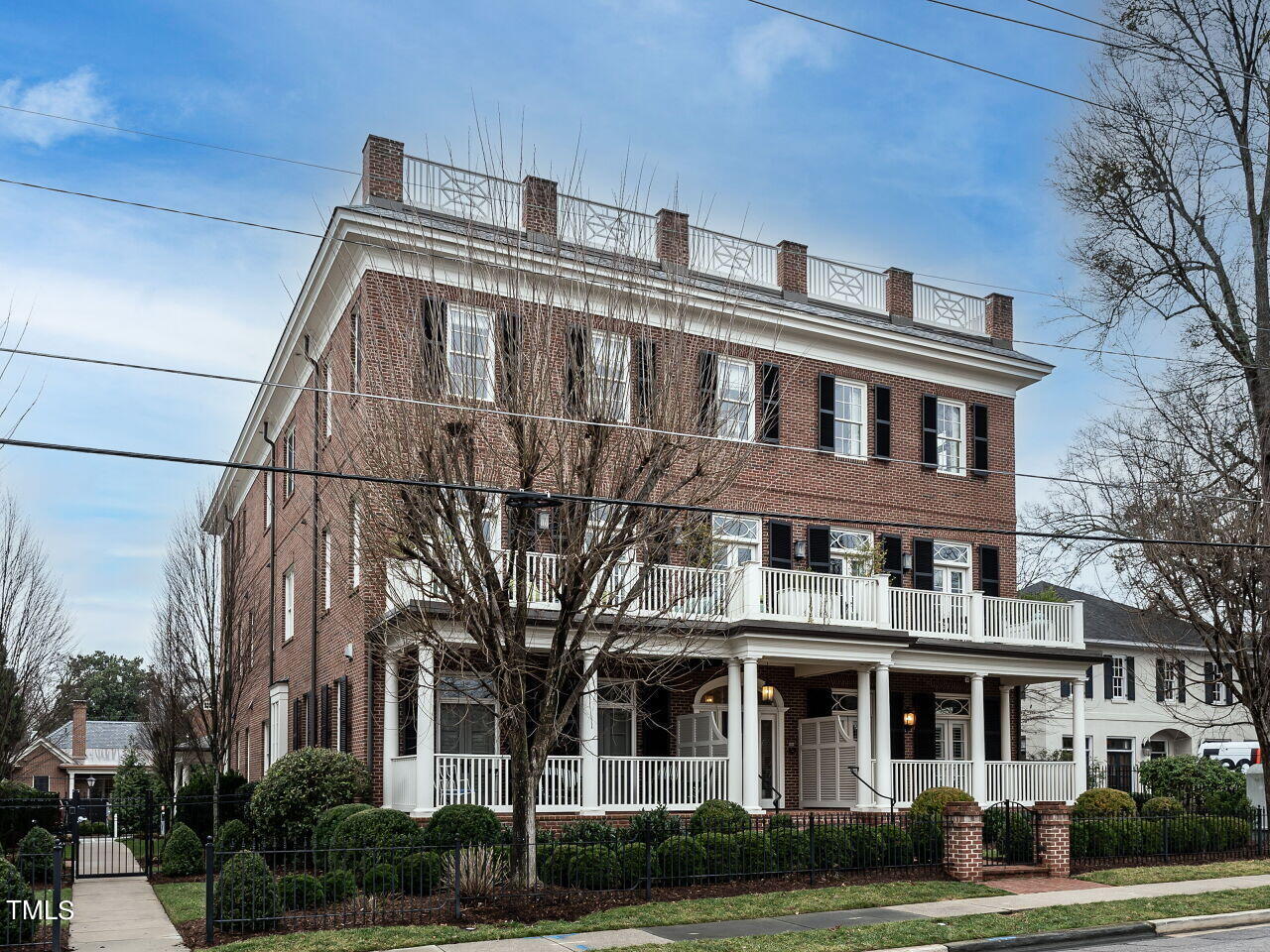 2017 Fairview Road, Unit 100 Raleigh, NC 27608 - Photo 3 of 32 a front view of a residential apartment building with a yard
