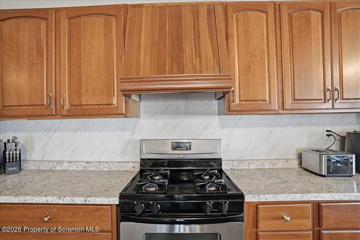 2909 Potter Hill Road Thompson, PA 18465 - Photo 21 of 80 a stove top oven sitting inside of a kitchen