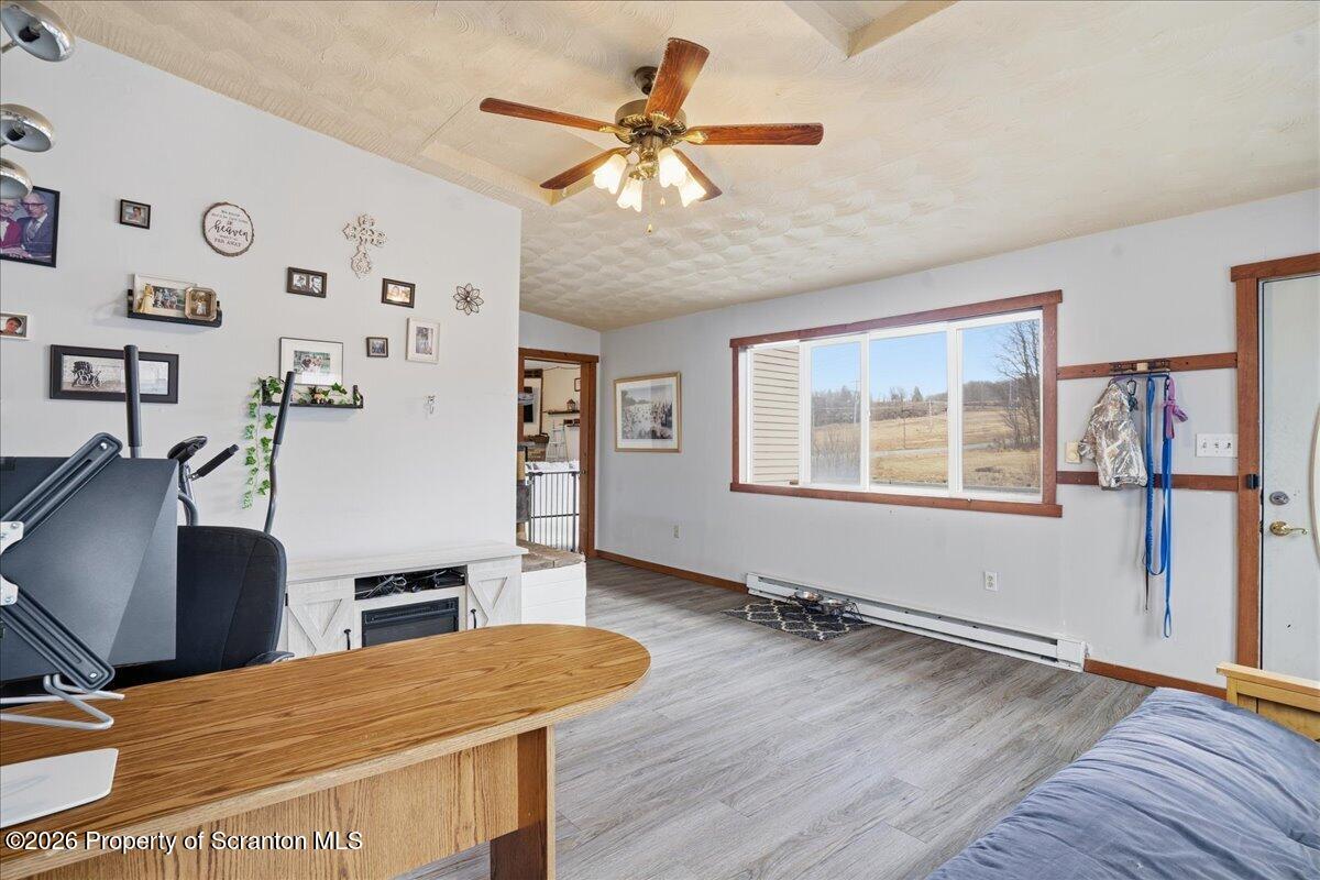 2909 Potter Hill Road Thompson, PA 18465 - Photo 32 of 80 a workspace with furniture wooden floor and window