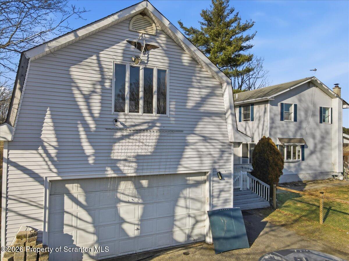 2909 Potter Hill Road Thompson, PA 18465 - Photo 61 of 80 a front view of a house with sitting area