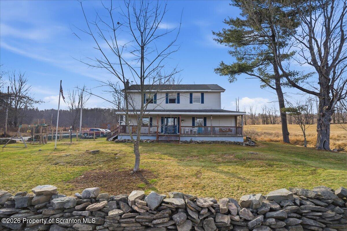 2909 Potter Hill Road Thompson, PA 18465 - Photo 7 of 80 a view of a swimming pool with a patio