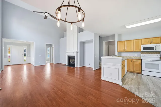 a view of kitchen with furniture and wooden floor
