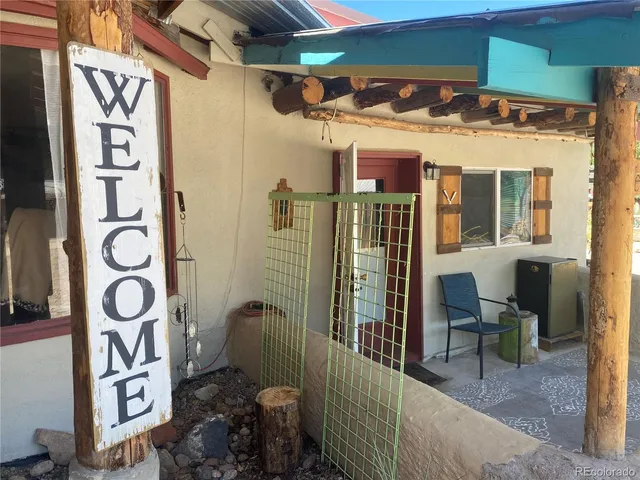 a view of a house with a potted plant and a window