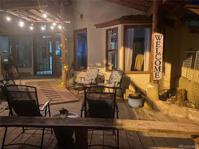 a swimming pool with outdoor seating