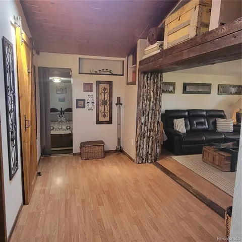a view of livingroom with furniture and wooden floor