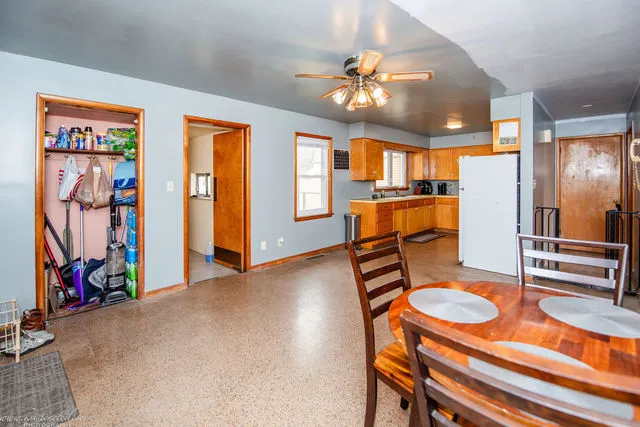 a view of a dining room with furniture and chandelier