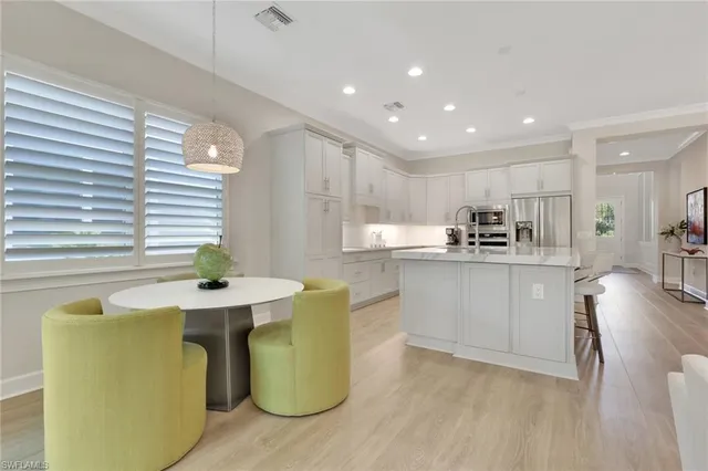 a kitchen with cabinets a sink and appliances