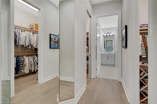 a bathroom with a shower sink and mirror